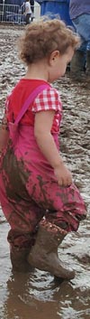 toddler in mud